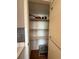 Walk-in pantry features four shelves for organized storage of food items at 225 Country Club Dr # 1506, Largo, FL 33771