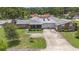 Expansive aerial view of a well-maintained home featuring a two-car garage and mature landscaping at 2270 Spruce Ln # B, Palm Harbor, FL 34684