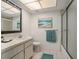This well-lit bathroom features a shower and a clean and simple design at 2270 Spruce Ln # B, Palm Harbor, FL 34684