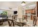 Open-concept layout combining the dining area, living room, and kitchen, perfect for entertaining at 2270 Spruce Ln # B, Palm Harbor, FL 34684