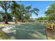 Community basketball court with surrounding trees, offering recreational opportunities for residents at 2377 Hounds Trl, Palm Harbor, FL 34683
