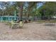 Outdoor patio space with picnic tables and grills, perfect for community gatherings and relaxation at 2377 Hounds Trl, Palm Harbor, FL 34683