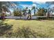 Community playground with swings and slide, providing a fun and safe play area for children at 2377 Hounds Trl, Palm Harbor, FL 34683