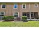 Backyard view showing the exterior of the home with well-maintained lawn and landscaping at 26835 Juniper Bay Dr, Wesley Chapel, FL 33544