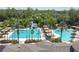 The community pool features tall palm trees and a winding waterslide at 26835 Juniper Bay Dr, Wesley Chapel, FL 33544