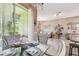 Dining area leading to the living room featuring an open floor plan and great natural light at 26835 Juniper Bay Dr, Wesley Chapel, FL 33544