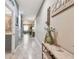 A welcoming hallway boasts stylish decor and seamlessly connects to other parts of the home at 26835 Juniper Bay Dr, Wesley Chapel, FL 33544