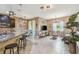 Open floor plan with a living area, kitchen, and dining space, perfect for modern living at 26835 Juniper Bay Dr, Wesley Chapel, FL 33544