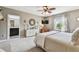 Comfortable bedroom featuring an ensuite bathroom and a window with natural light at 26835 Juniper Bay Dr, Wesley Chapel, FL 33544