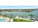 Waterfront backyard and bay overview showcasing private docks and poolside seating at 31 Island Way # 406, Clearwater Beach, FL 33767