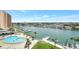 Waterfront condo boasts views of the marina, pool and Intracoastal Waterway, showcasing coastal living at 31 Island Way # 406, Clearwater Beach, FL 33767