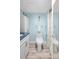 Charming bathroom with blue accents, including a mermaid wall decoration and a blue marble countertop at 31 Island Way # 406, Clearwater Beach, FL 33767