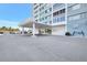Image of the Horizon House condo building entrance with covered parking at 31 Island Way # 406, Clearwater Beach, FL 33767