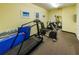 Well-equipped exercise room includes a treadmill, rowing machine, yoga accessories and a mirrored wall at 31 Island Way # 406, Clearwater Beach, FL 33767