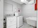 Functional laundry room includes a washer, dryer, utility sink, and storage for easy chore management at 31 Island Way # 406, Clearwater Beach, FL 33767