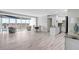 Open-concept living space with abundant natural light, tile floors, and picturesque city views at 31 Island Way # 406, Clearwater Beach, FL 33767