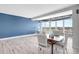 Dining area with great water views and a modern chandelier at 31 Island Way # 406, Clearwater Beach, FL 33767