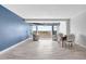 Spacious living room with a view and elegant furnishings, including a dining area and balcony at 31 Island Way # 406, Clearwater Beach, FL 33767