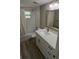 Contemporary bathroom with a white vanity, modern fixtures, and a shower-tub combination at 3150 Beacon Square Dr, Holiday, FL 34691