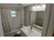 Modern bathroom featuring a vanity with a white countertop and a shower-tub combo at 3150 Beacon Square Dr, Holiday, FL 34691