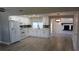 Bright, open kitchen with white cabinets, modern appliances, and stylish backsplash at 3150 Beacon Square Dr, Holiday, FL 34691