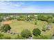 Aerial view of the community park, featuring a baseball field, green spaces, and recreation areas at 3325 Schefflera Rd, Tampa, FL 33618