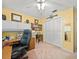 Bright bedroom with a built-in desk, shelving, and closet, offering functional space and storage at 3325 Schefflera Rd, Tampa, FL 33618