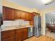 Modern kitchen featuring granite countertops, stainless steel appliances, and wooden cabinets at 3325 Schefflera Rd, Tampa, FL 33618