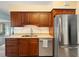 Gourmet kitchen features stainless steel appliances, wood cabinets, and granite countertops at 3325 Schefflera Rd, Tampa, FL 33618