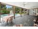 Inviting screened lanai with ample seating, providing a tranquil outdoor living space with a pool view at 3325 Schefflera Rd, Tampa, FL 33618