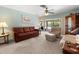 Bright living room showcasing comfortable seating and view of the outdoor pool and lanai at 3325 Schefflera Rd, Tampa, FL 33618