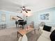 Inviting living room with grand piano, plush seating, and tranquil blue walls at 3325 Schefflera Rd, Tampa, FL 33618