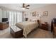 Comfortable bedroom with vintage decor, a ceiling fan, and warm-toned walls at 3325 Schefflera Rd, Tampa, FL 33618