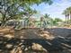 Fun-filled community playground with slides and play equipment, set in a shady, wood-chipped area at 3325 Schefflera Rd, Tampa, FL 33618