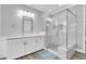 Modern bathroom with glass-enclosed shower, sleek vanity, and contemporary finishes at 3477 Barbour Trl, Odessa, FL 33556