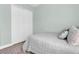 Bedroom featuring light green walls, neutral decor, and a closet with white doors at 3477 Barbour Trl, Odessa, FL 33556