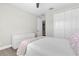 Bedroom featuring neutral walls, white dresser, and large closet with white doors at 3477 Barbour Trl, Odessa, FL 33556