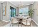 Elegant dining room with a modern chandelier and view of the pool at 3477 Barbour Trl, Odessa, FL 33556