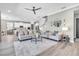 Spacious living room with neutral tones, an open floor plan, and modern furnishings at 3477 Barbour Trl, Odessa, FL 33556
