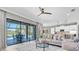Inviting living room with a view of the outdoor pool and patio through sliding glass doors at 3477 Barbour Trl, Odessa, FL 33556