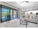 Inviting living room with an open floor plan and direct access to outdoor pool and patio at 3477 Barbour Trl, Odessa, FL 33556