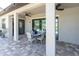 Covered patio area perfect for outdoor dining and relaxation, with decorative pavers at 3477 Barbour Trl, Odessa, FL 33556