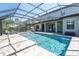 Inviting screened-in pool and patio area with lounge chairs, ideal for entertaining or relaxing at 3477 Barbour Trl, Odessa, FL 33556