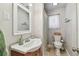 Small bathroom featuring a sink, mirror, toilet and shower with curtain at 3545 59Th N Ln, St Petersburg, FL 33710