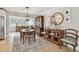 Charming dining area adjacent to the living room, features classic furniture and ample decor at 3545 59Th N Ln, St Petersburg, FL 33710