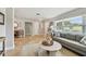 Inviting living area showcases travertine floors, neutral decor, and lots of natural light at 3545 59Th N Ln, St Petersburg, FL 33710