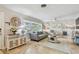 Cozy living room featuring neutral tones, tile floors, and large windows for ample natural light at 3545 59Th N Ln, St Petersburg, FL 33710