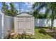 A gray storage shed offers plenty of room for storing gardening equipment, sporting goods, and outdoor items at 3545 59Th N Ln, St Petersburg, FL 33710