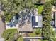 Aerial view of the home showcasing the roof, solar panels, landscaping, and surrounding neighborhood at 3898 49Th S Ave, St Petersburg, FL 33711
