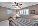 Bedroom featuring shuttered windows, a ceiling fan, and neutral décor at 3898 49Th S Ave, St Petersburg, FL 33711